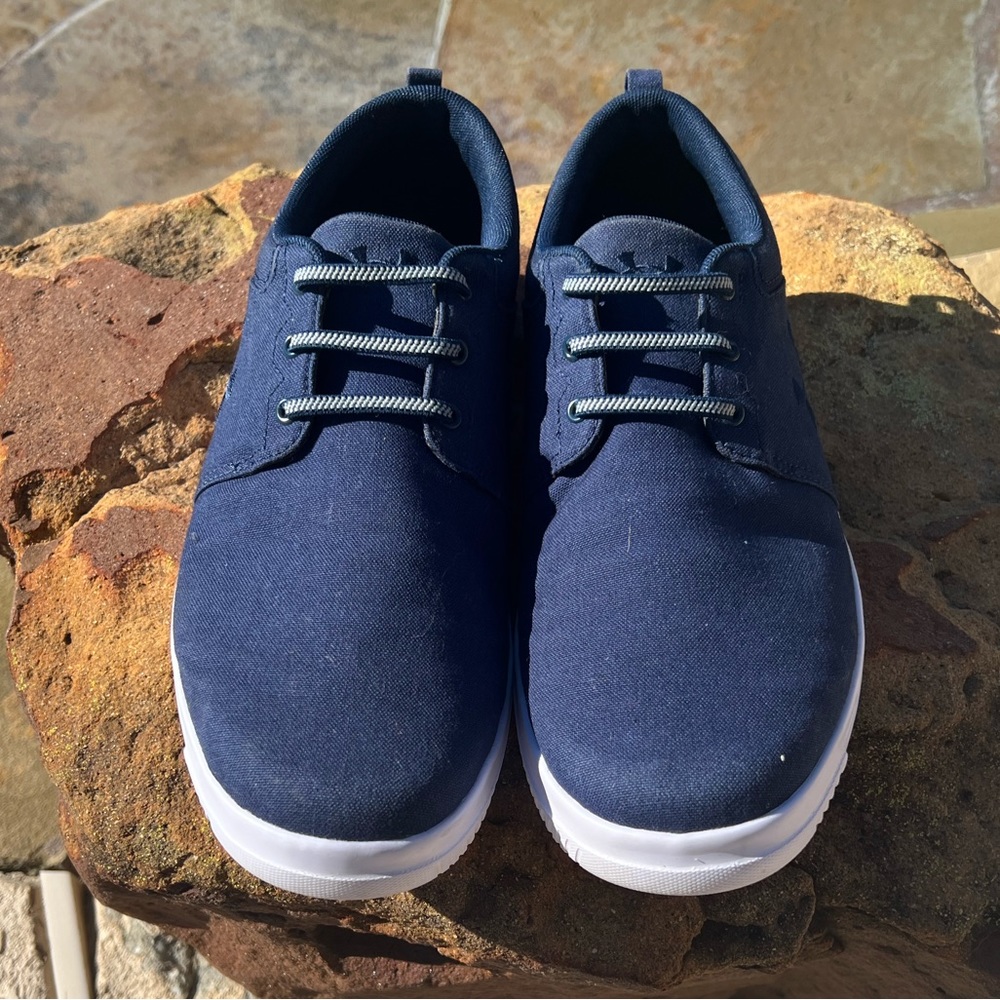 Men’s Blue Under Armer slip on tennis shoes. Size 10